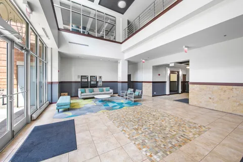a view of a living room and kitchen view