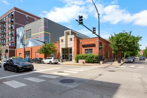 a city street lined with buildings and cars