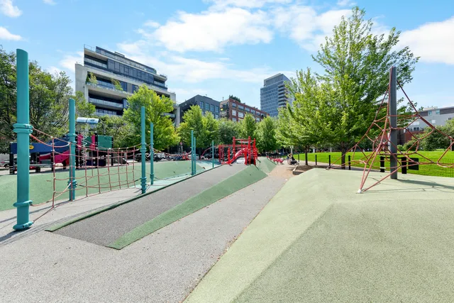 a view of street with tall buildings