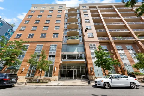 a view of a car parked in front of a building