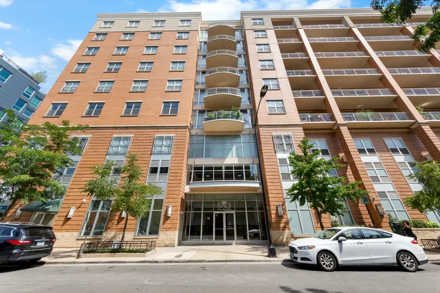 a view of a car parked in front of a building
