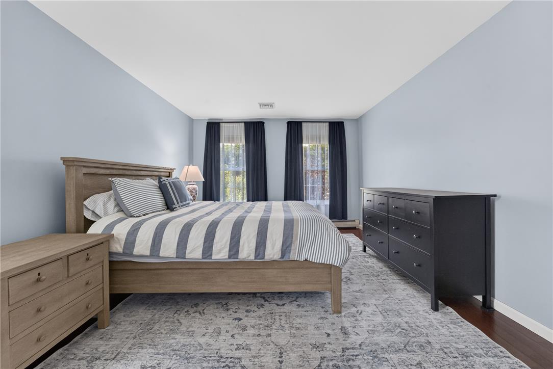 220 Pennbrook Road Stroudsburg, PA 18360 - Photo 26 of 60 Hardwood floors and generous windows elevate this serene primary bedroom.