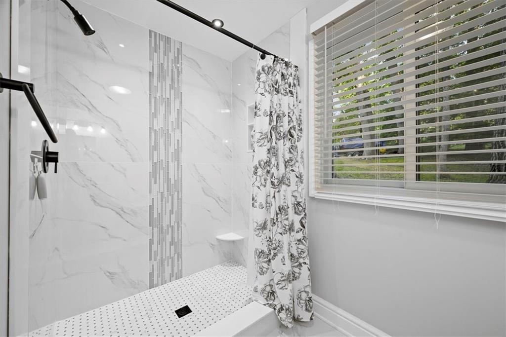 228 Foxglove Road Baden, PA 15005 - Photo 11 of 25 a bathroom with a shower and a window