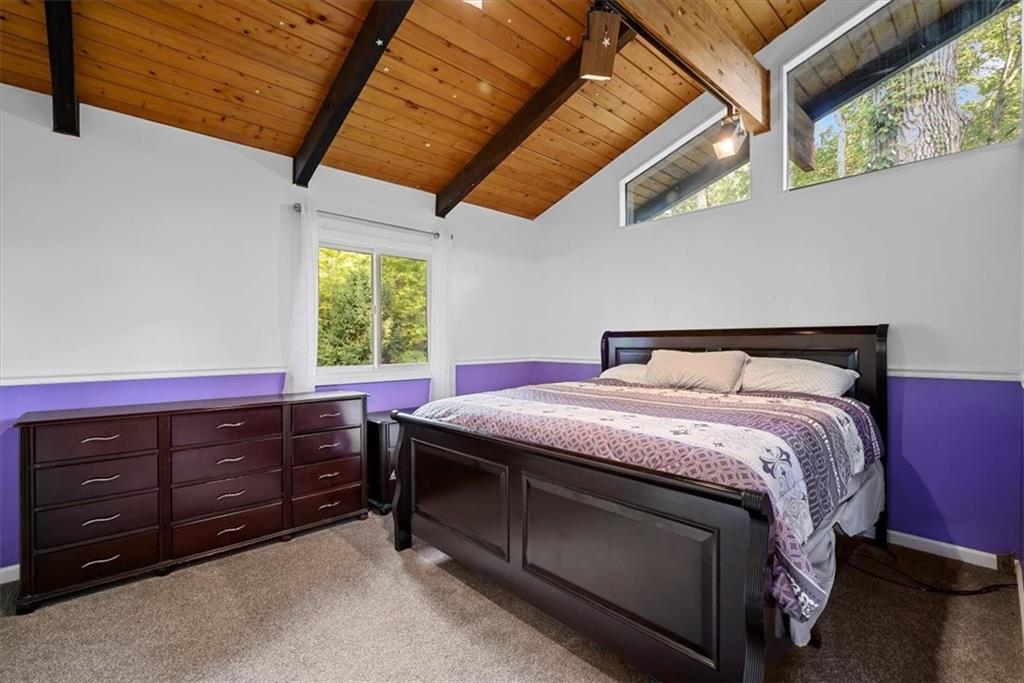 228 Foxglove Road Baden, PA 15005 - Photo 15 of 25 a bed sitting in a bedroom next to a window