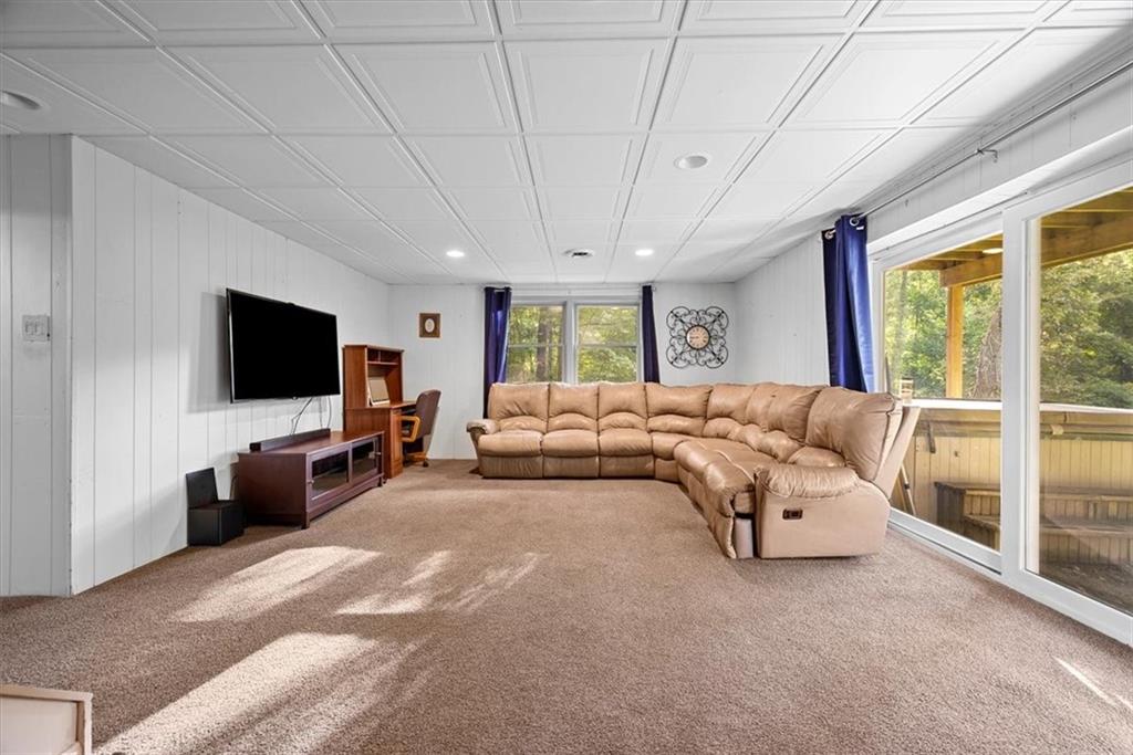 228 Foxglove Road Baden, PA 15005 - Photo 19 of 25 a bedroom with a bed and a flat screen tv