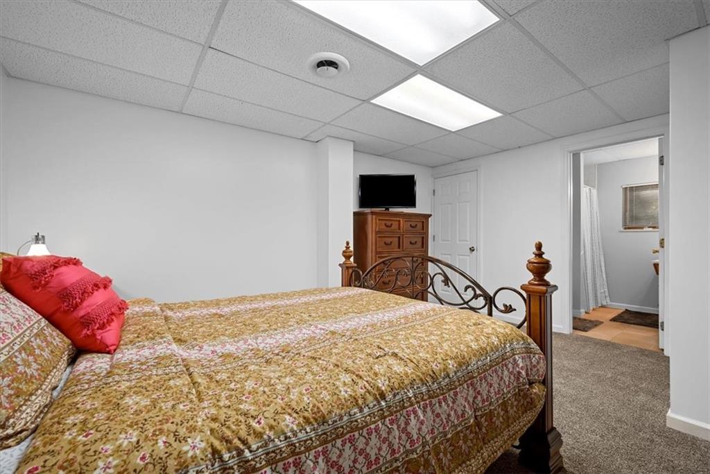 228 Foxglove Road Baden, PA 15005 - Photo 20 of 25 a bedroom with a bed and a mirror