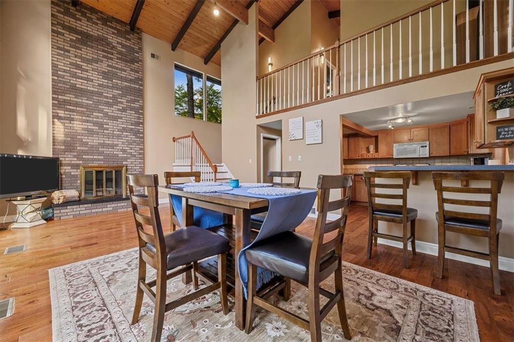 228 Foxglove Road Baden, PA 15005 - Photo 4 of 25 a dining room with furniture a rug and wooden floor