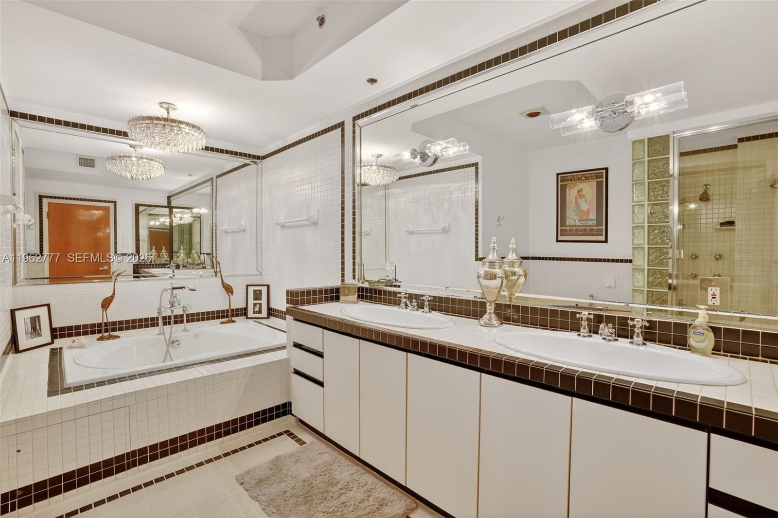 1330 Ocean Drive, Unit R7C Miami Beach, FL 33139 - Photo 14 of 21 a bathroom with a double vanity sink and mirror