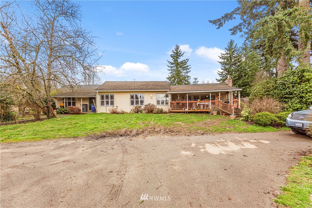 24125 7th Avenue Southeast Bothell, WA 98021 - Photo 13 of 18 a view of house in front of a big yard with large trees
