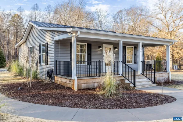 a view of a house with a small yard