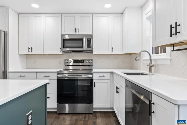 a view of a kitchen with washer and dryer