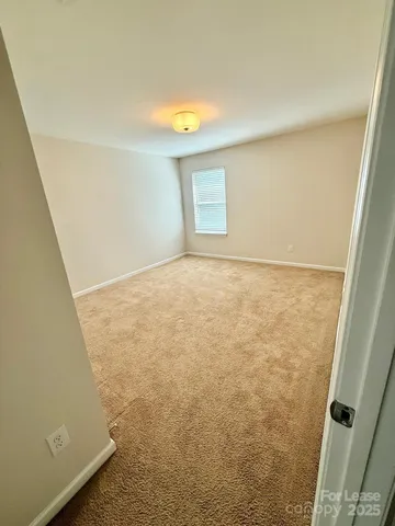 a spacious bathroom with a granite countertop sink mirror and a bath tub