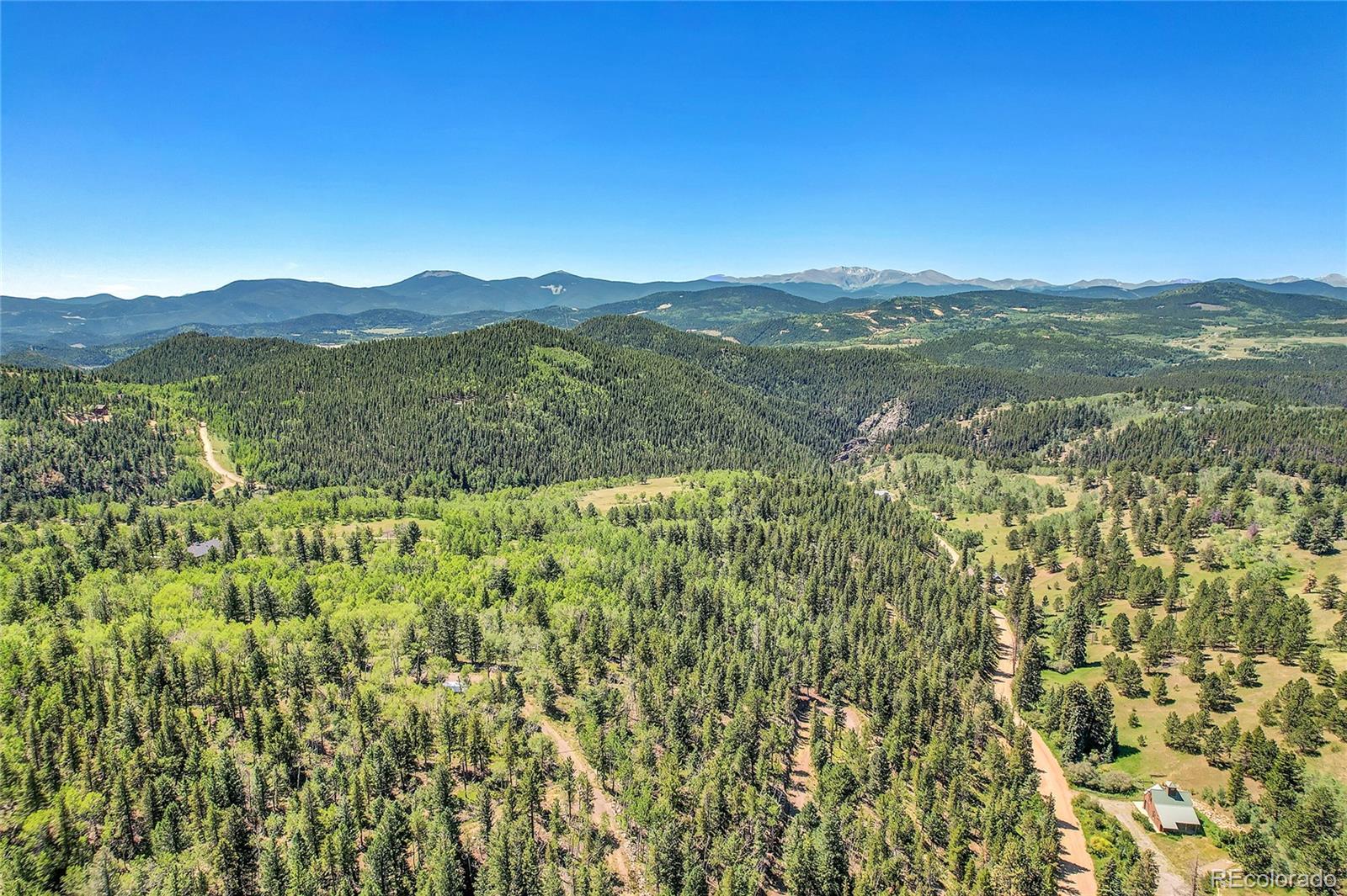 5 Hughesville Road Black Hawk, CO 80422 - Photo 5 of 17 a view of a city with lush green forest