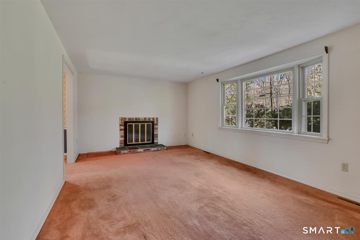 40 Wappingwood Road Ellington, CT 06029 - Photo 11 of 31 Also, features a fireplace and great natural light from the bay window.