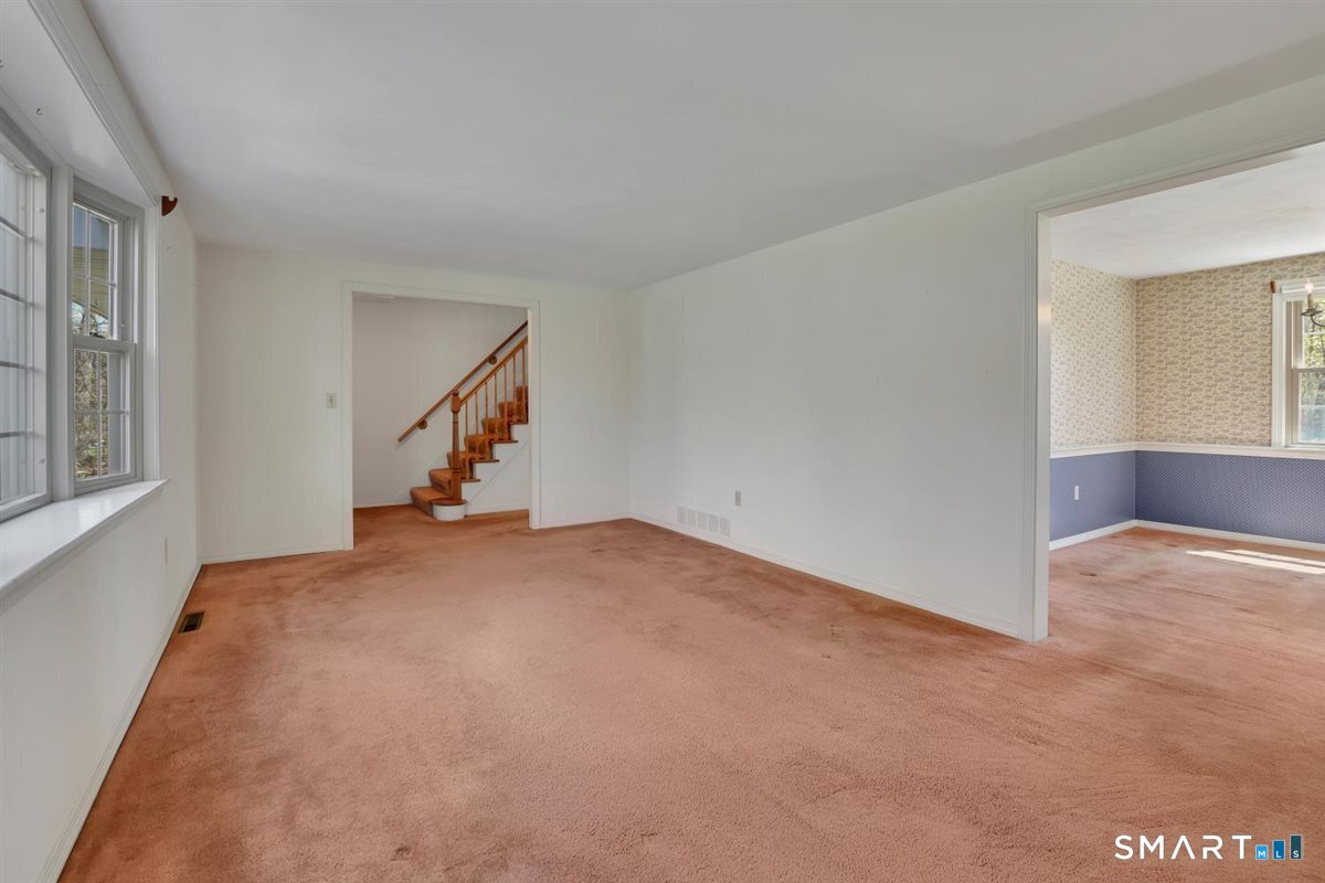 40 Wappingwood Road Ellington, CT 06029 - Photo 12 of 31 From the living room, enjoy easy access to the entryway and staircase leading to the upper level.