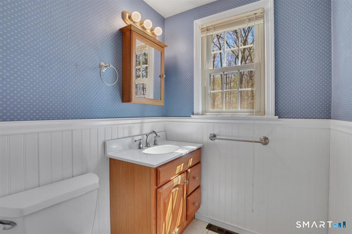 40 Wappingwood Road Ellington, CT 06029 - Photo 13 of 31 Light-filled half bath on the main level for added convenience.
