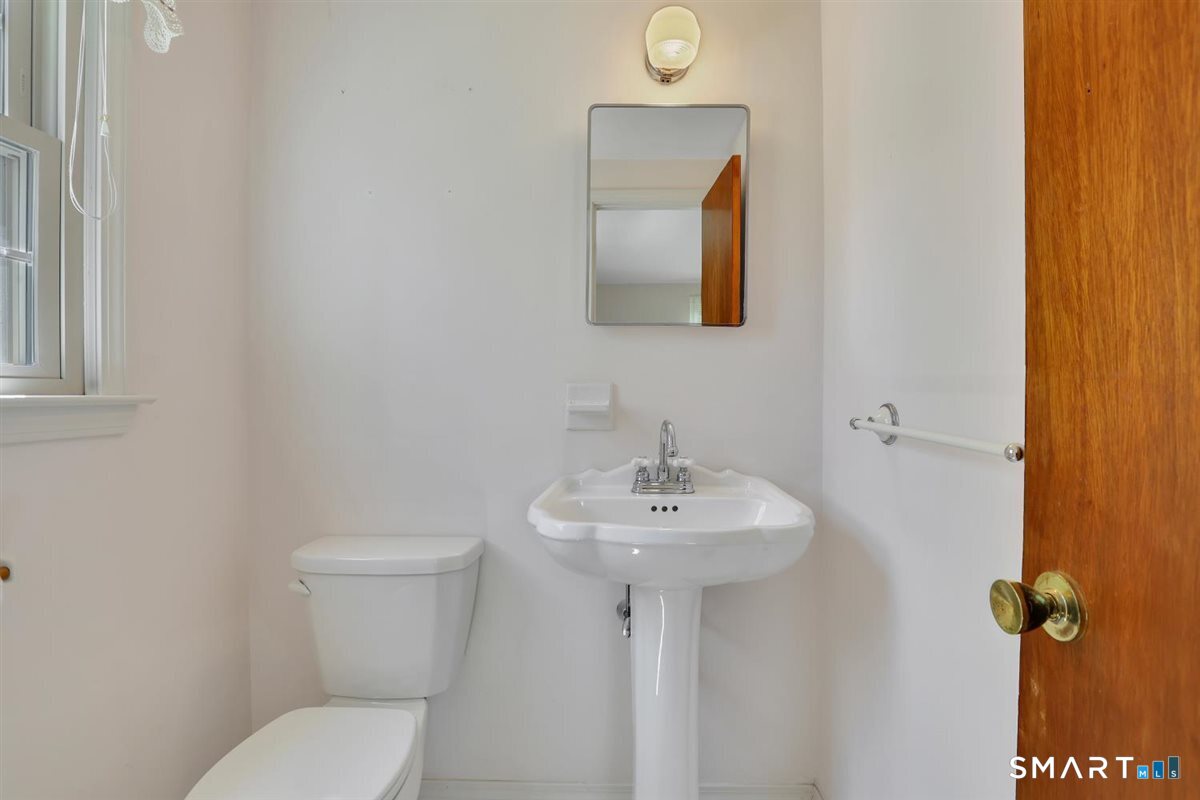 40 Wappingwood Road Ellington, CT 06029 - Photo 17 of 31 The private half bath features additional natural light.