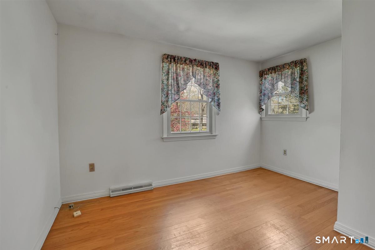 40 Wappingwood Road Ellington, CT 06029 - Photo 19 of 31 Like all bedrooms on the upper level, this room features hardwood floors and additional storage.
