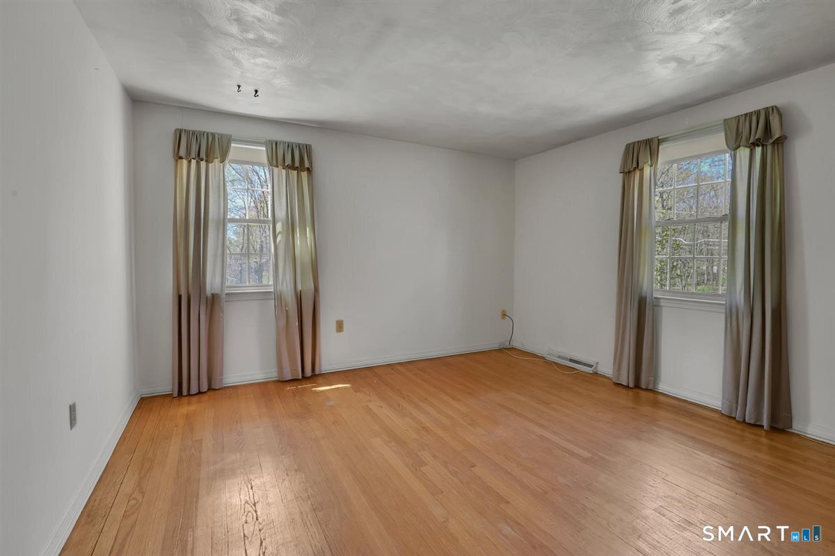 40 Wappingwood Road Ellington, CT 06029 - Photo 23 of 31 Spacious third bedroom with great natural light and hardwood floors.