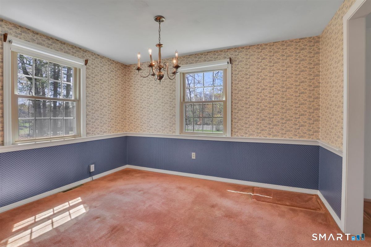40 Wappingwood Road Ellington, CT 06029 - Photo 7 of 31 Take a peek into this bright dining room filled with natural light.