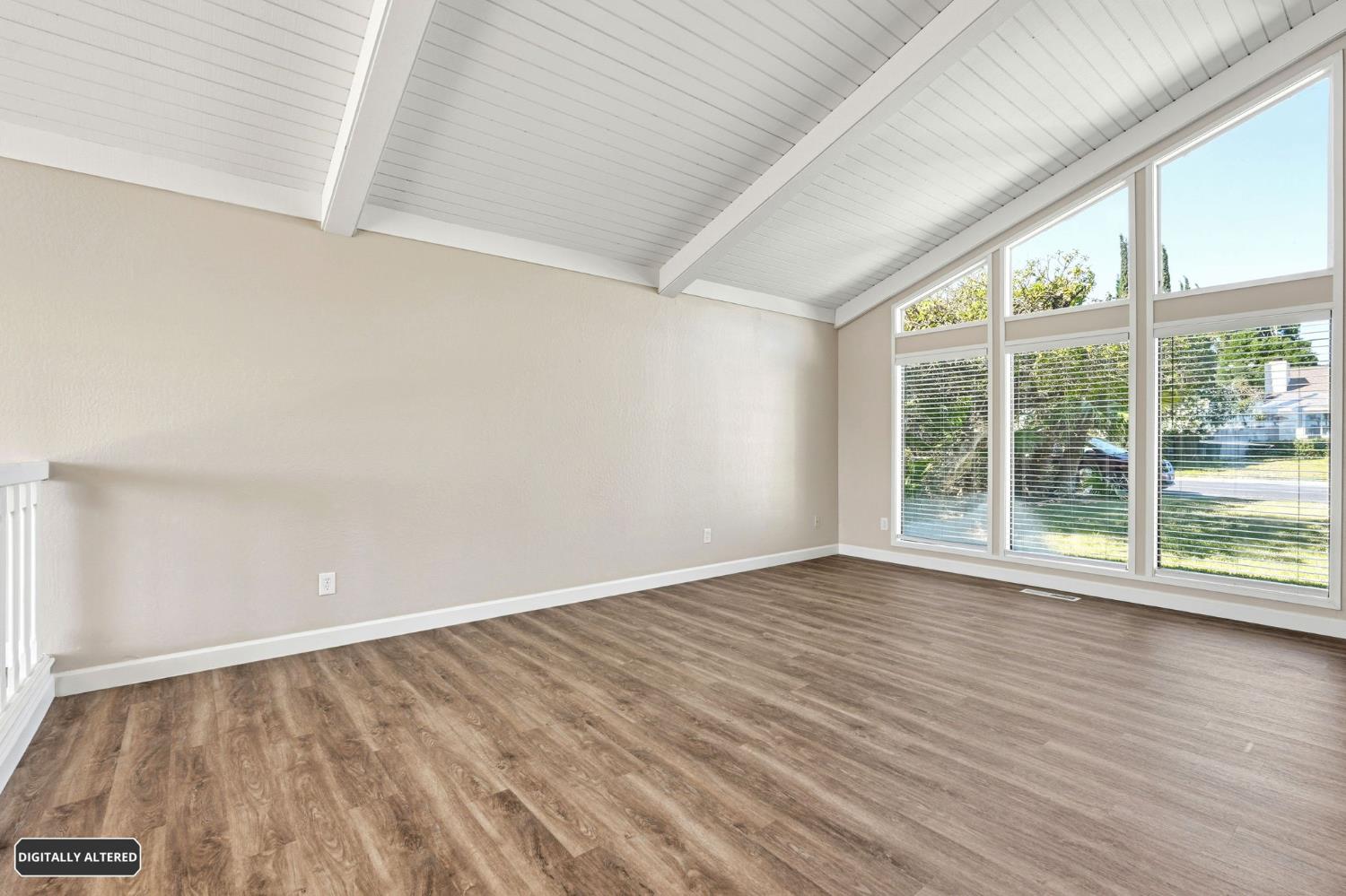 5501 Riverlake Road Discovery Bay, CA 94505 - Photo 13 of 60 a view of an empty room with wooden floor and a window