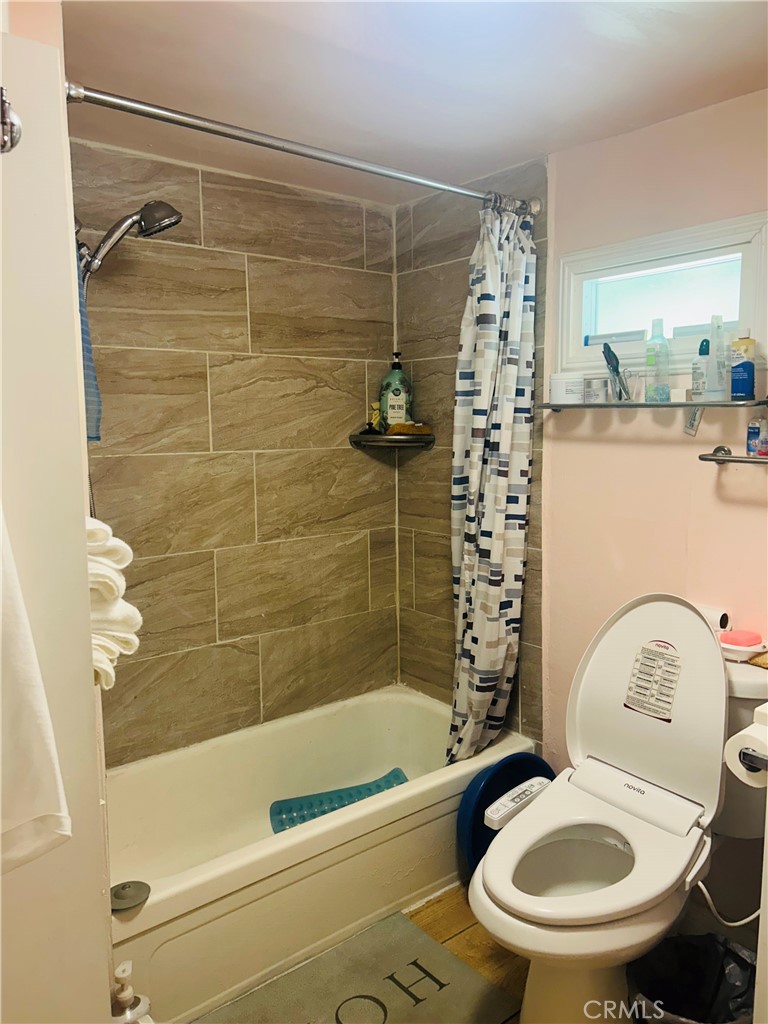 1436 West 130th Street Gardena, CA 90249 - Photo 12 of 13 a bathroom with a sink a toilet and a bathtub