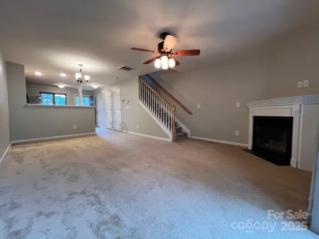 a view of an empty room with a fireplace