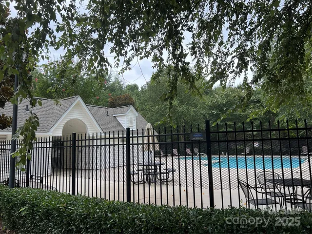 a view of a wrought iron fences in front of house