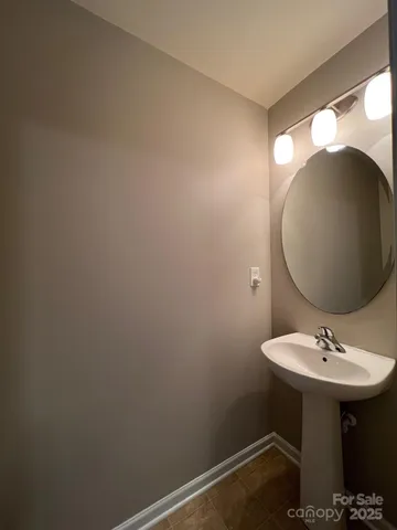 a bathroom with a sink and mirror
