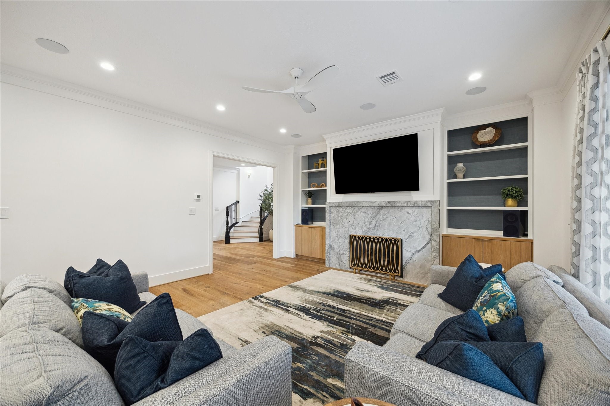 3615 Durness Way Houston, TX 77025 - Photo 13 of 46 a living room with furniture a fireplace and a flat screen tv