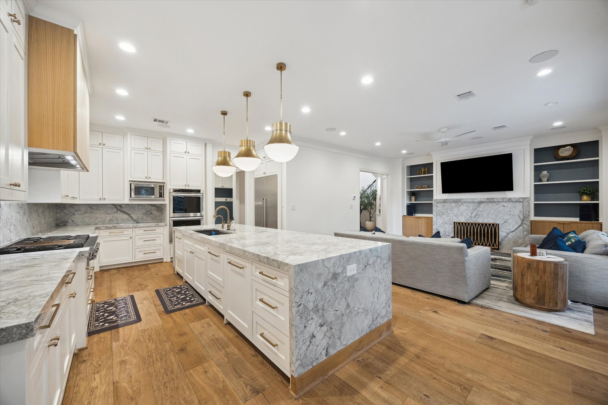 3615 Durness Way Houston, TX 77025 - Photo 16 of 46 a large white kitchen with a large window and stainless steel appliances