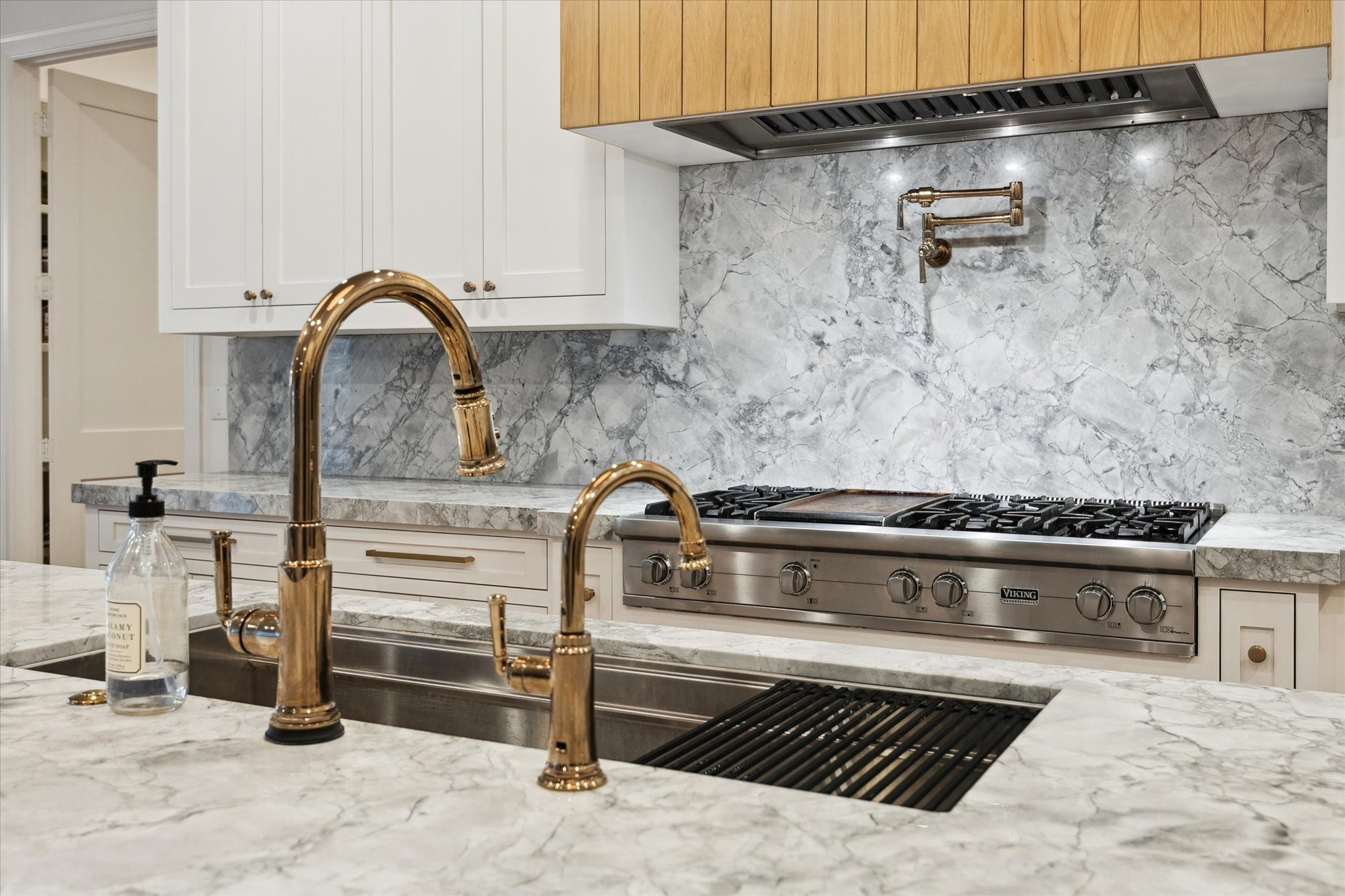 3615 Durness Way Houston, TX 77025 - Photo 18 of 46 a close view of a stove top oven and cabinets