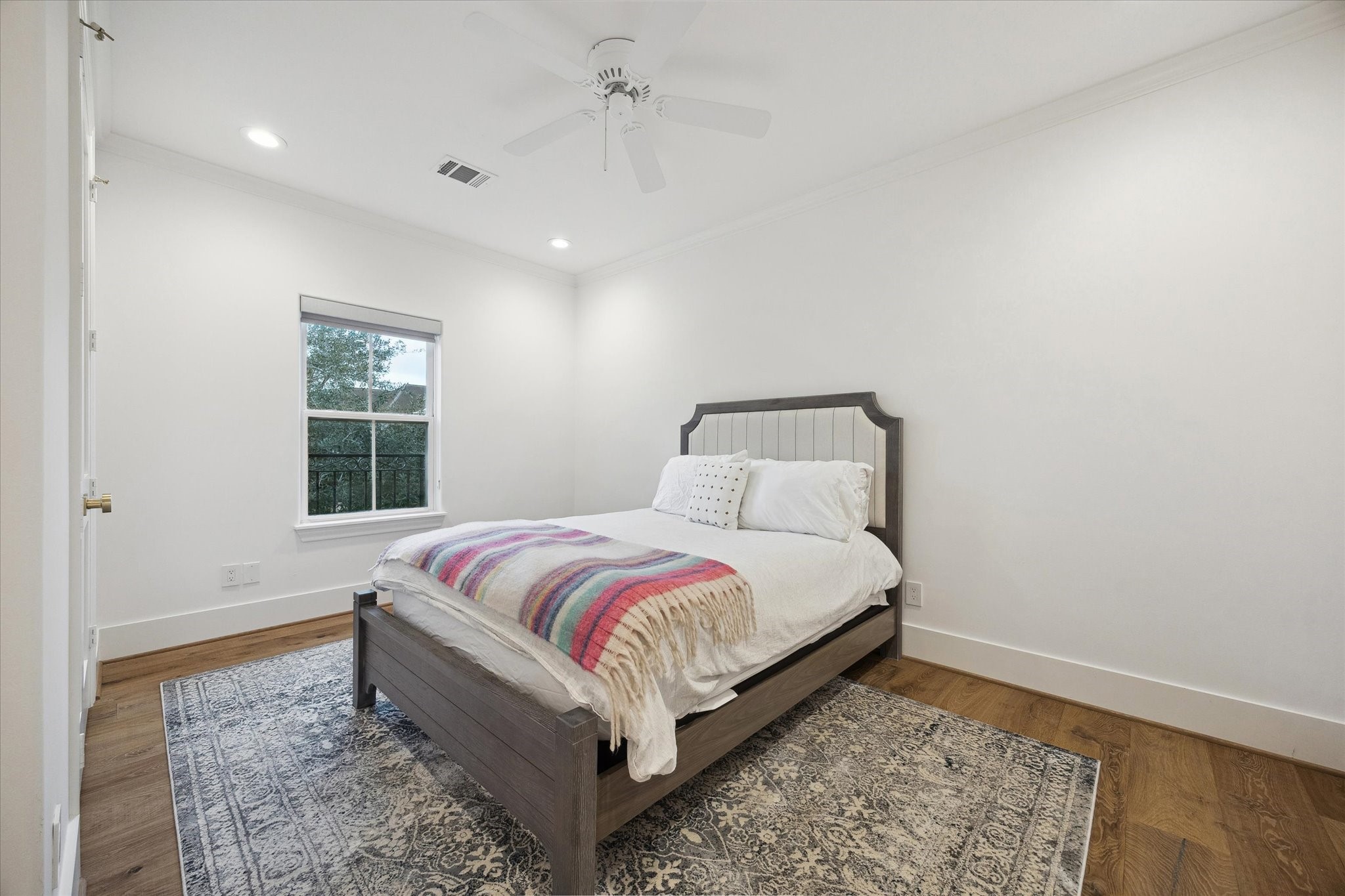 3615 Durness Way Houston, TX 77025 - Photo 26 of 46 a bed sitting in a spacious bedroom next to a window