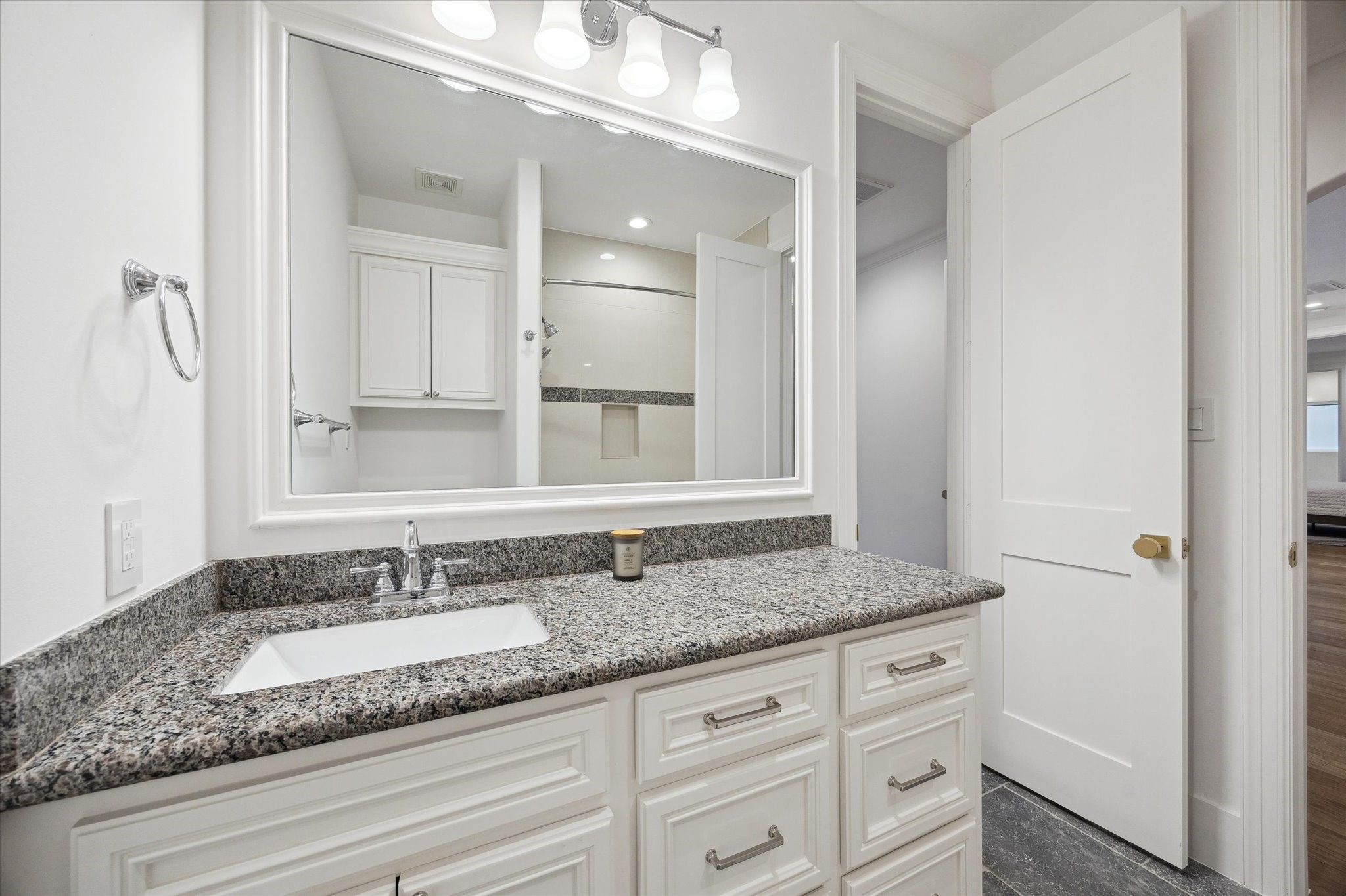 3615 Durness Way Houston, TX 77025 - Photo 27 of 46 a bathroom with a granite countertop sink and a mirror