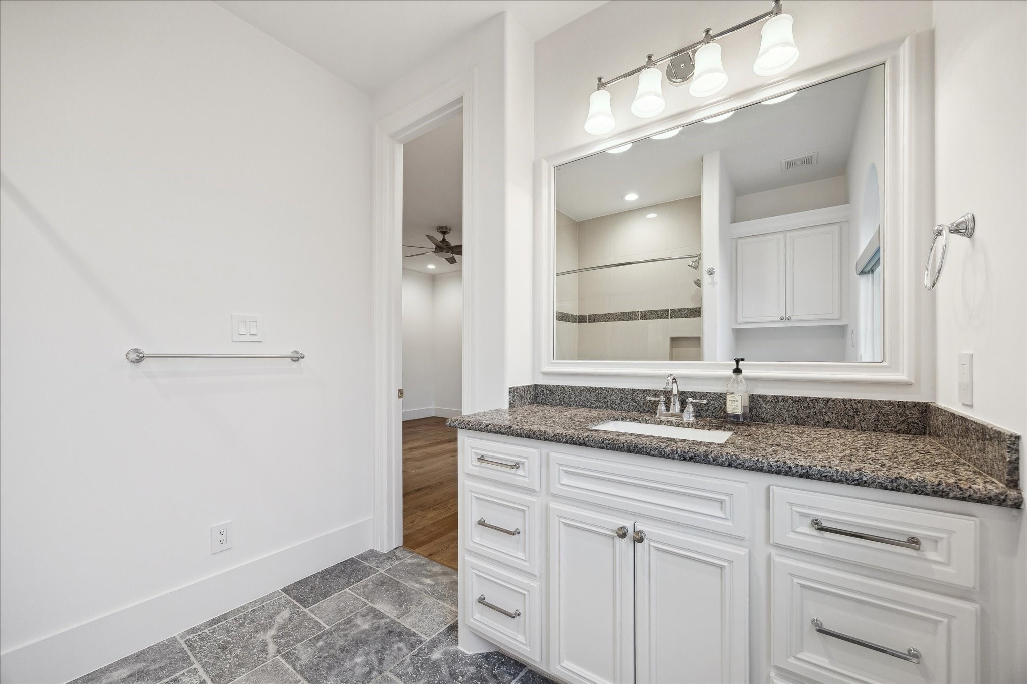 3615 Durness Way Houston, TX 77025 - Photo 29 of 46 a bathroom with a granite countertop sink and a mirror