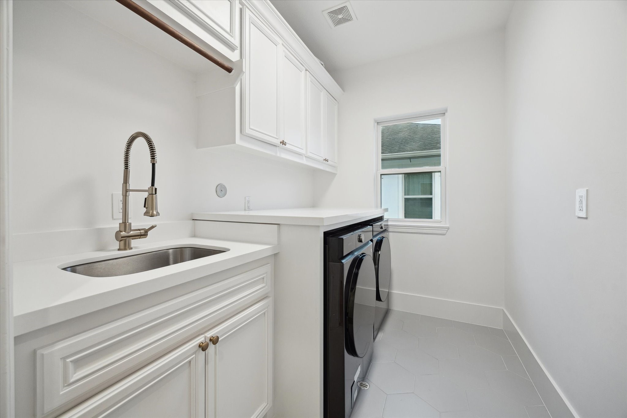3615 Durness Way Houston, TX 77025 - Photo 33 of 46 a close view of a sink and dishwasher in a kitchen