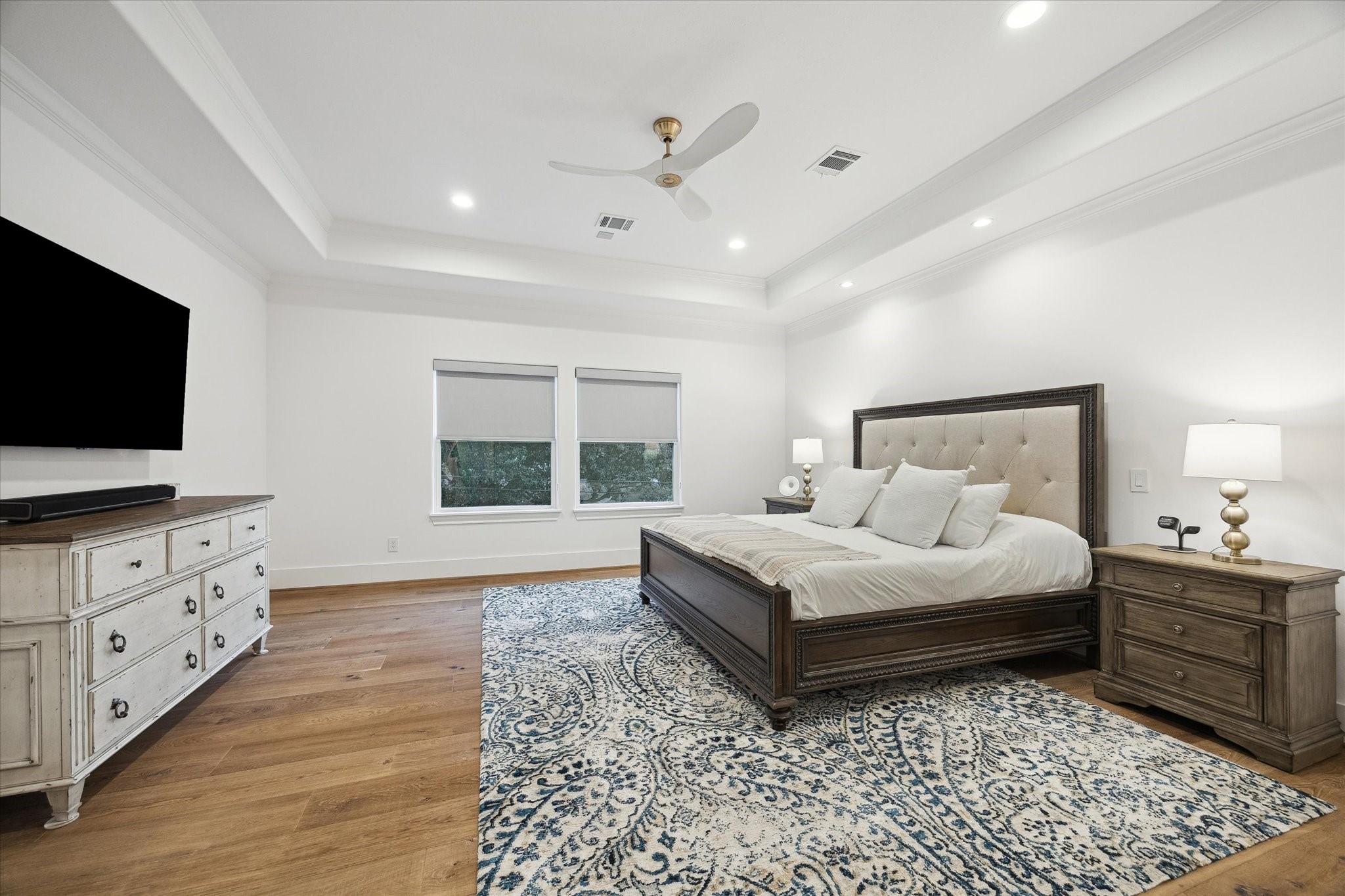 3615 Durness Way Houston, TX 77025 - Photo 34 of 46 a bedroom with a bed and a flat screen tv