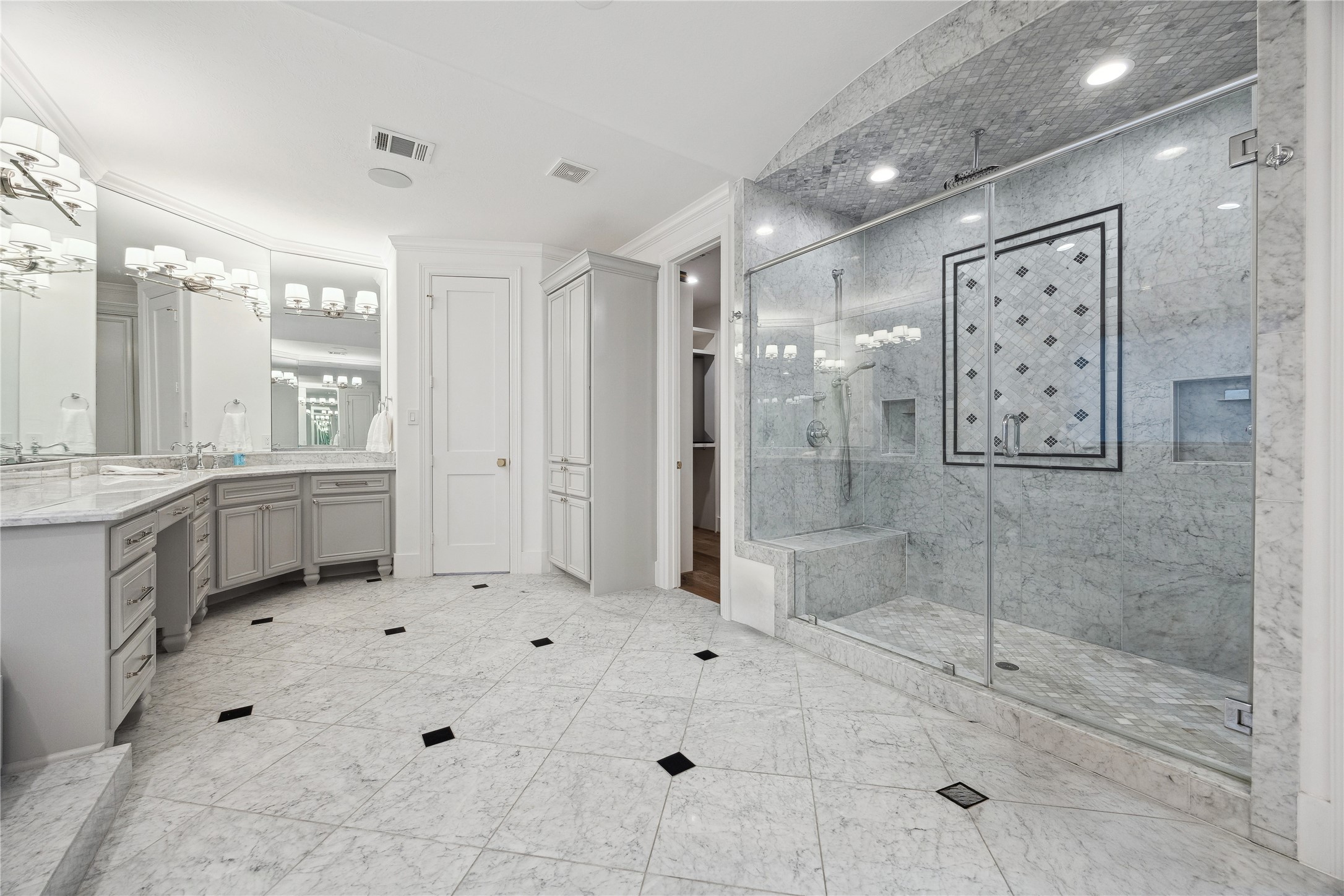 3615 Durness Way Houston, TX 77025 - Photo 37 of 46 a large bathroom with a shower sink and mirror