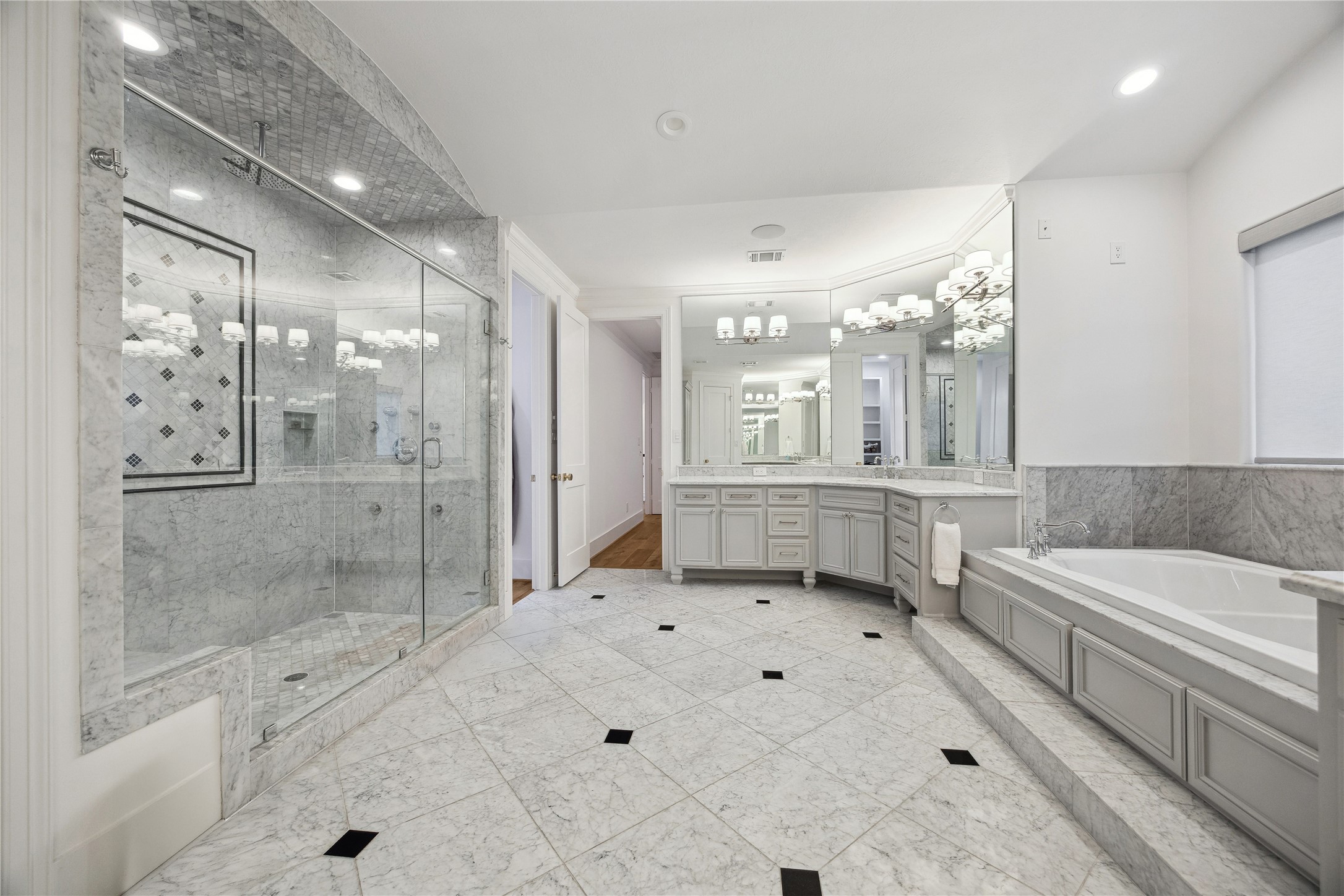 3615 Durness Way Houston, TX 77025 - Photo 38 of 46 a bathroom with a bathtub shower sink vanity and toilet