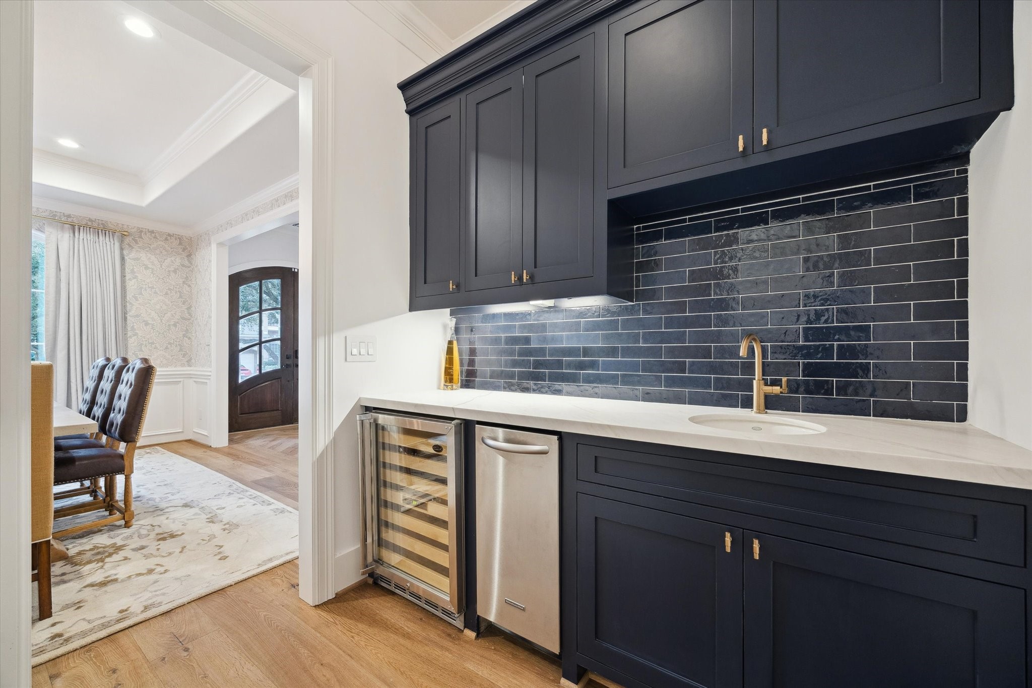 3615 Durness Way Houston, TX 77025 - Photo 9 of 46 a kitchen with a sink cabinets and wooden floor