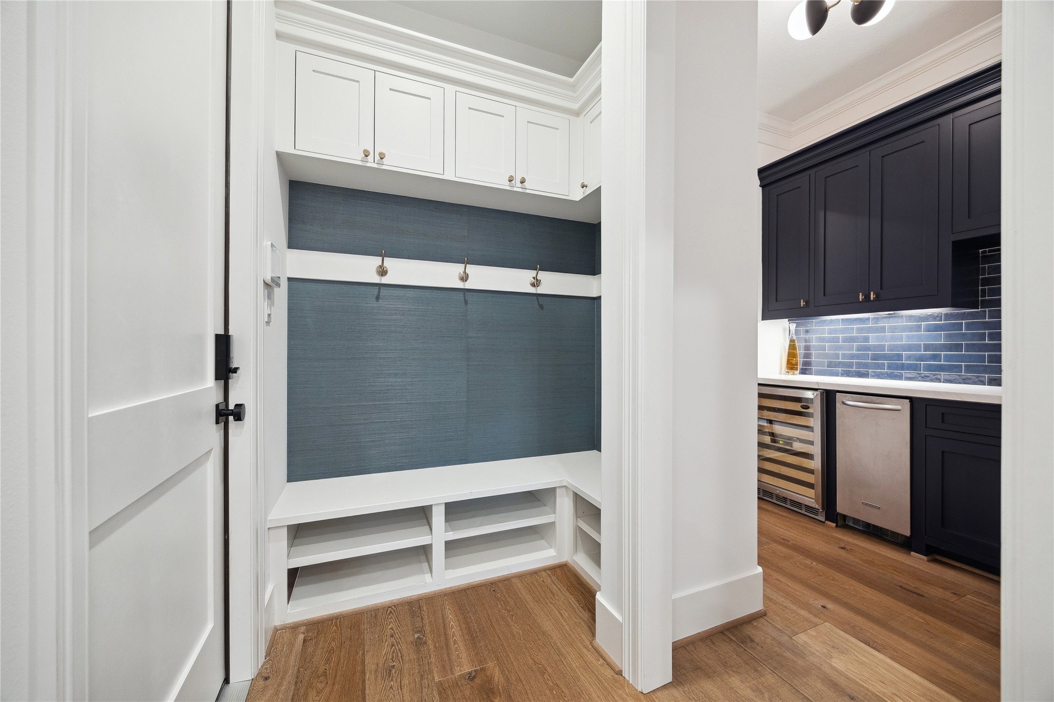 3615 Durness Way Houston, TX 77025 - Photo 10 of 46 a view of walk in closet with wooden floor and cabinets