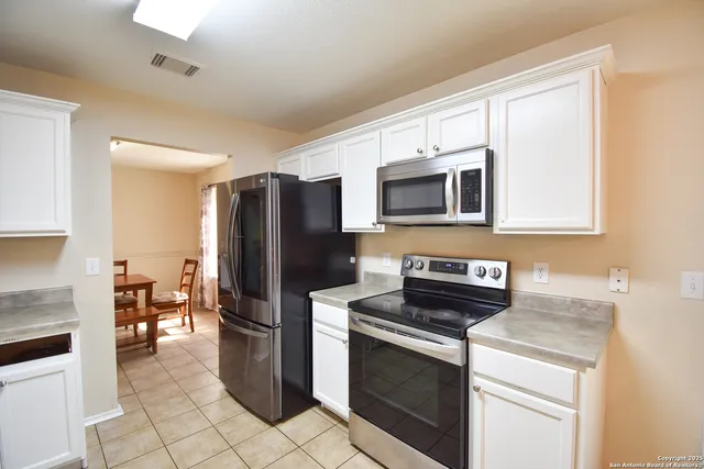 a kitchen with a stove microwave and refrigerator