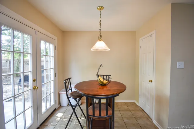 a dining room with furniture and window