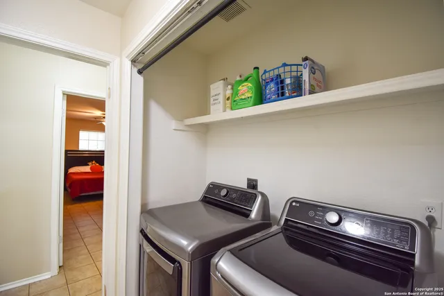 a utility room with dryer and washer