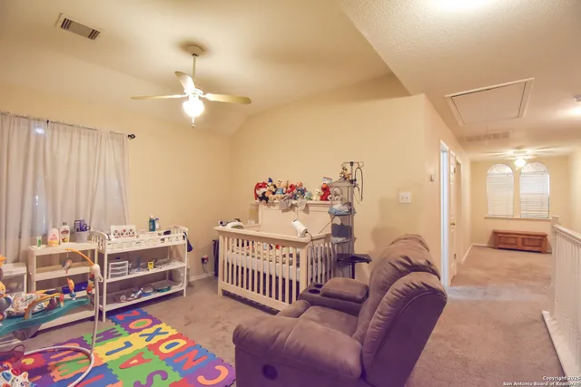 a bedroom with furniture and a chandelier