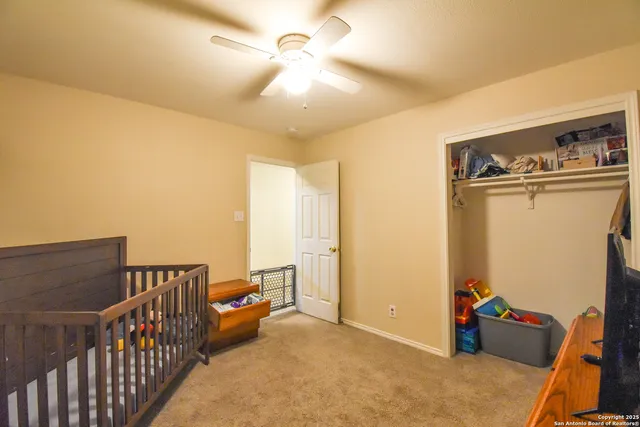 a view of a room with furniture ceiling fan and a window