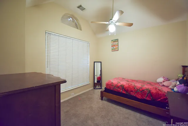 a bedroom with a bed and a table