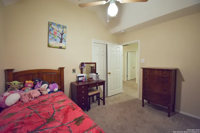 a bedroom with a bed and a dresser in it