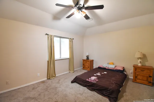 a bed room with a bed and a chandelier