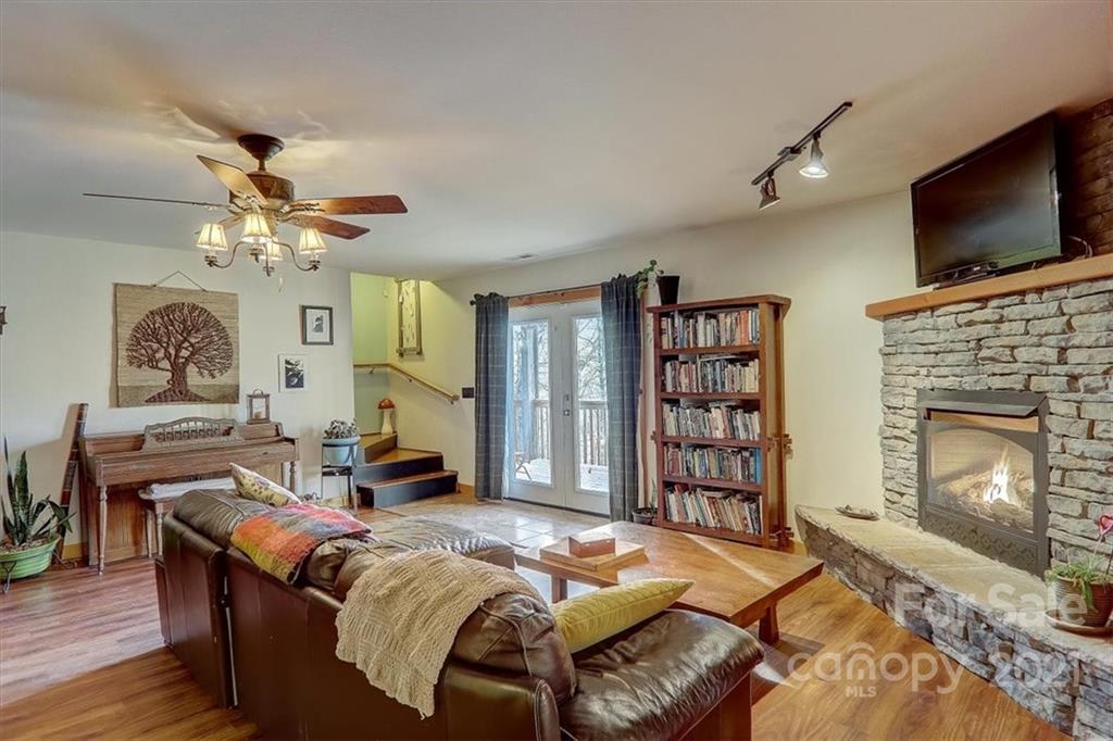 263 Summer Circle Clyde, NC 28721 - Photo 18 of 36 a living room with furniture fireplace and flat screen tv